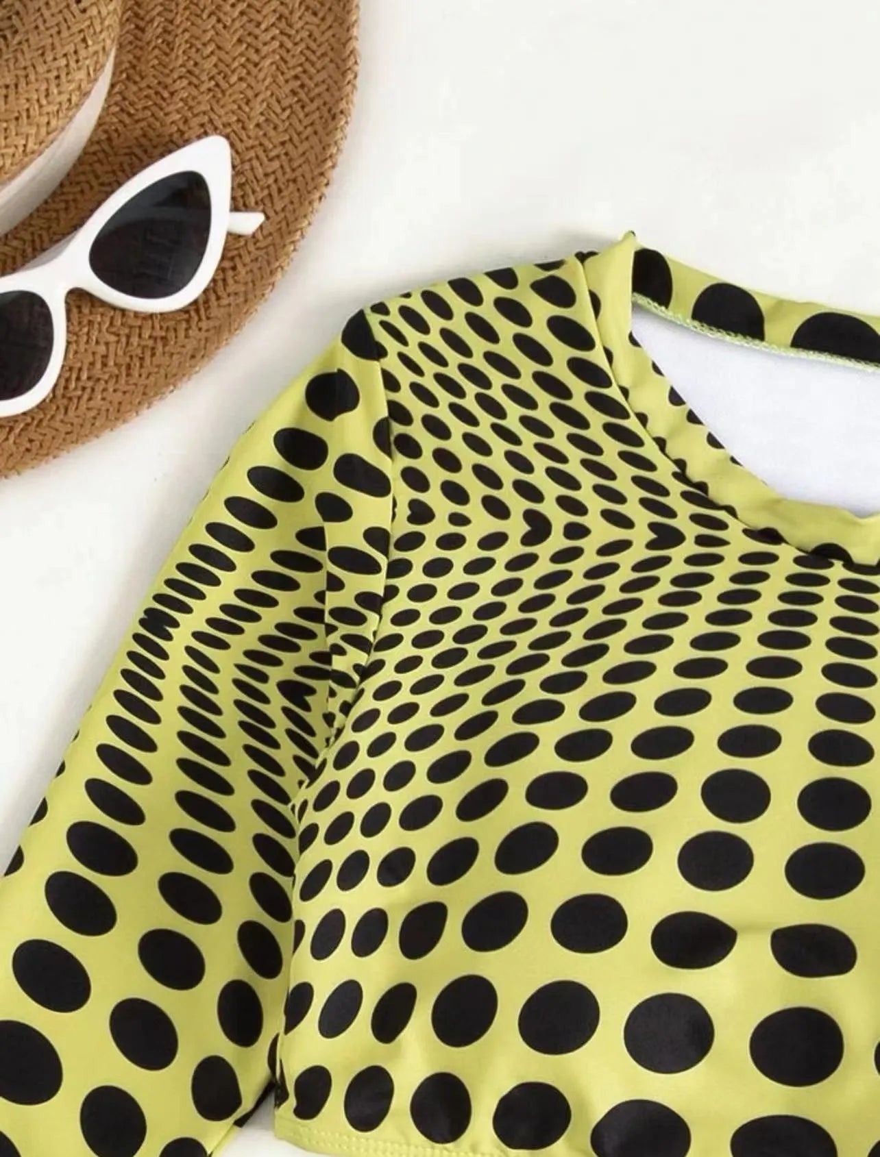 Women's green polka dot swimsuit three-piece set showing top, skirt and bra components