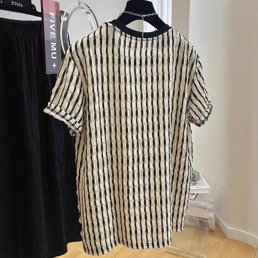 Black and white striped men's loose-fit short sleeve casual shirt made from linen blend fabric.