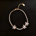 Gold colour copper bracelet with geometric quadrilateral design and inlaid zircon stones