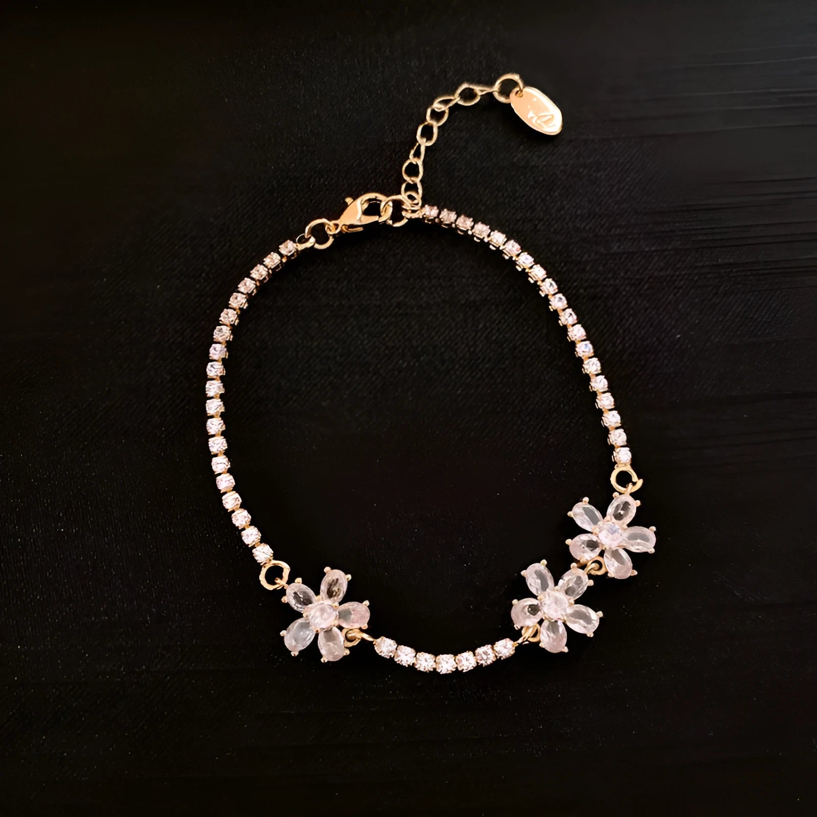 Gold colour copper bracelet with geometric quadrilateral design and inlaid zircon stones
