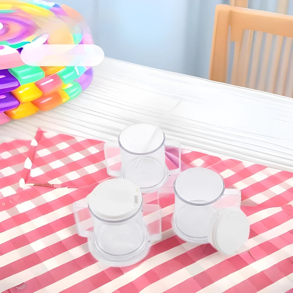 Transparent plastic spill-proof drinking cup on a table.