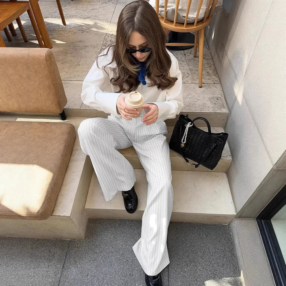 White striped wide-leg commuting trousers with zip closure on Asian-sized mannequin