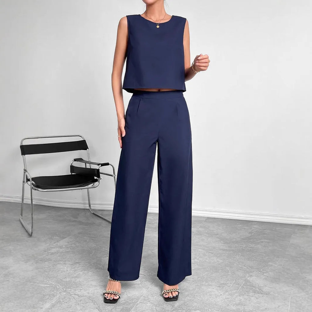 Red polyester two-piece set with sleeveless top and wide leg trousers