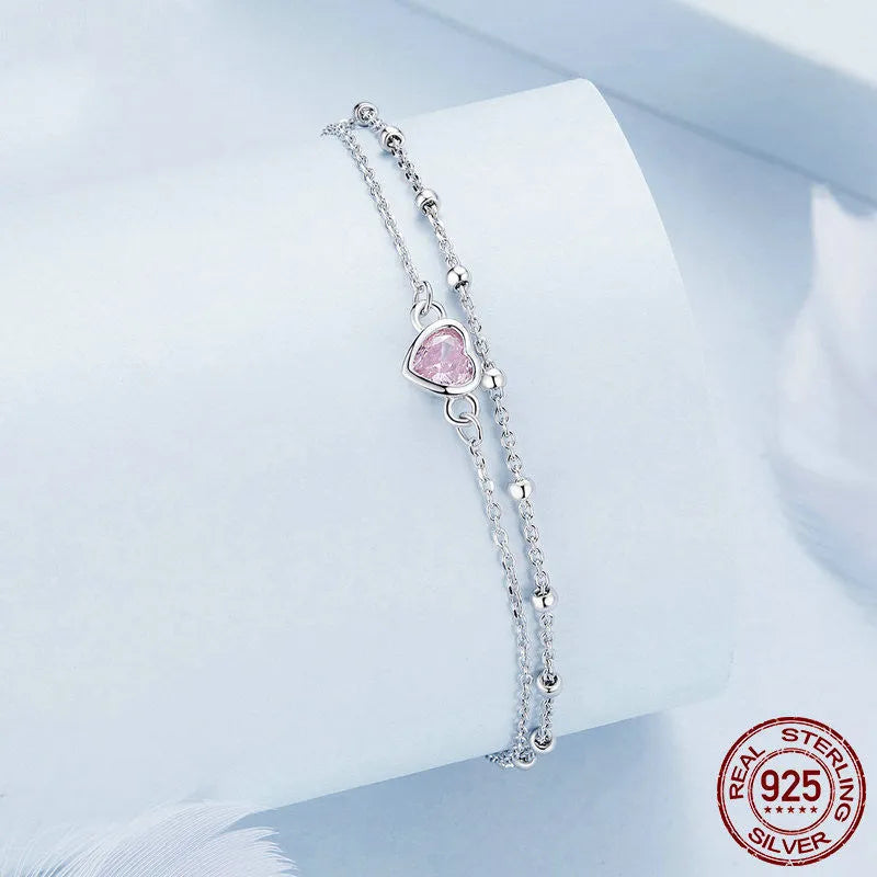Women's sweet heart-shaped 925 sterling silver bracelet with adjustable chain on wrist