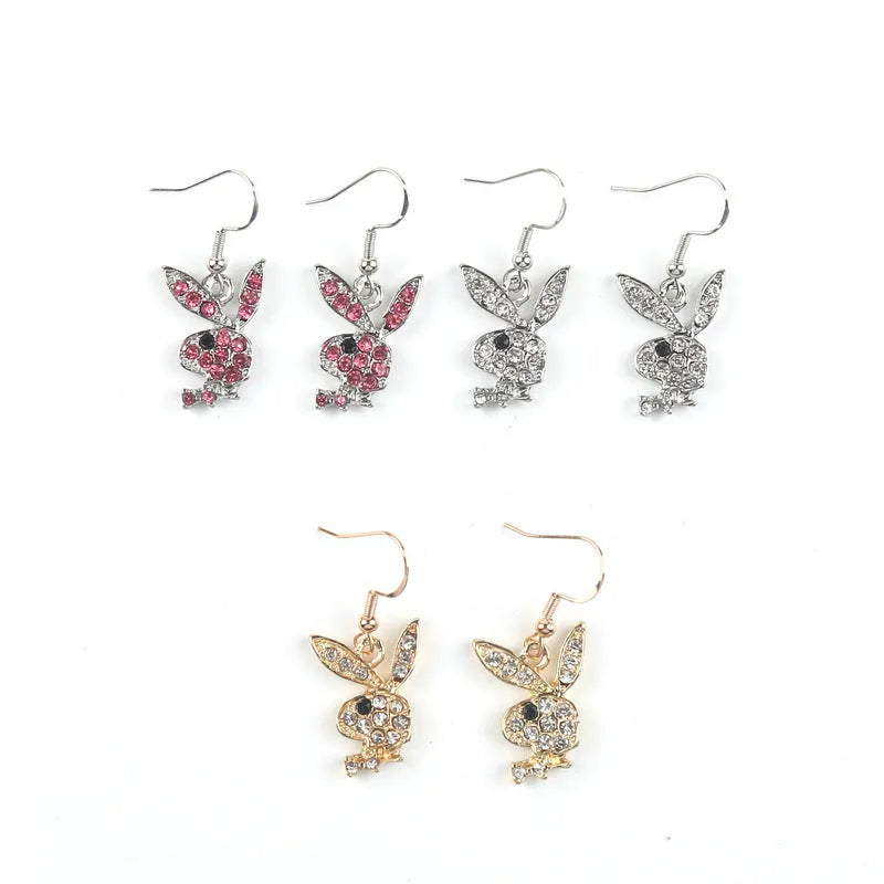 Close-up of alloy rabbit stud earrings with full diamond detail in silver, pink, or gold colour.