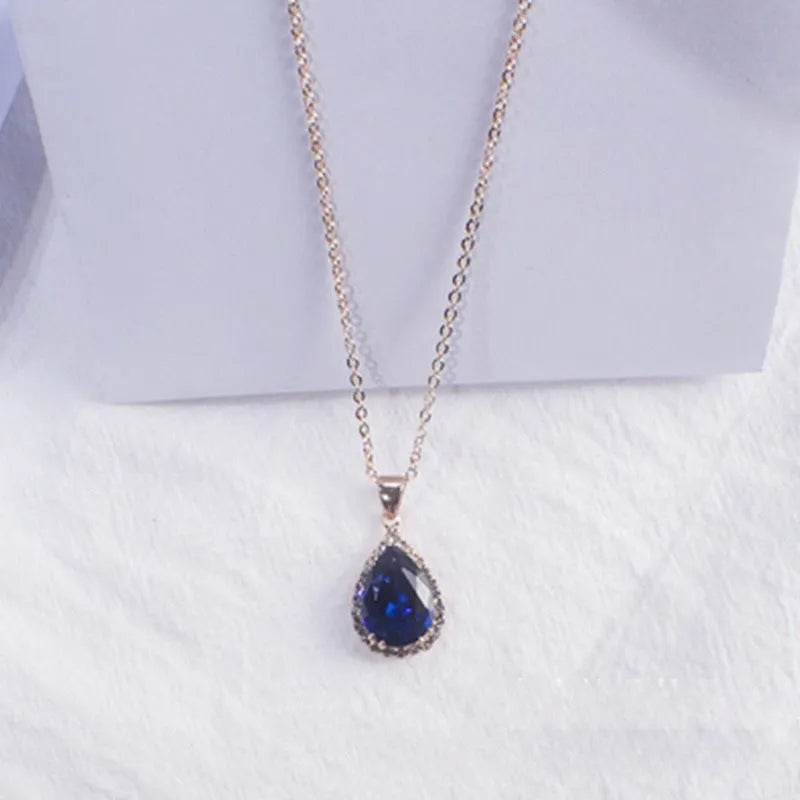 Women's water drop necklace with rose gold rhinestone and pink alloy gemstone pendant.