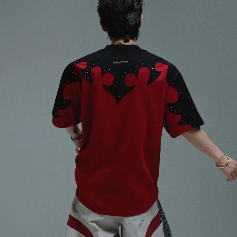Men's grey cotton T-shirt with a textured burnt flower design and rhinestone details on the front.