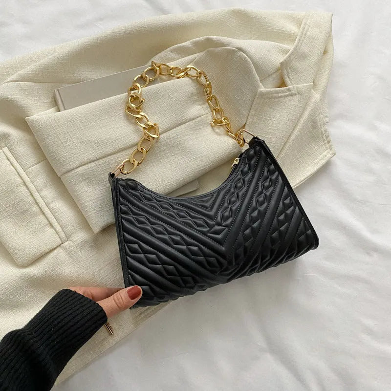 Brown pleated chain baguette shoulder bag with adjustable strap and soft carry handle