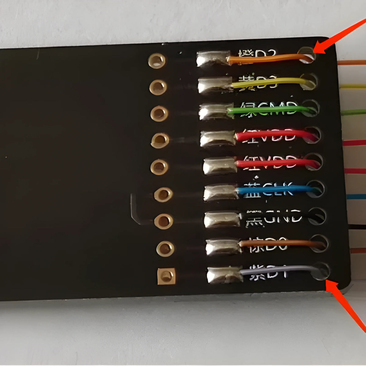 EMMC read and write tool for car audio host maintenance on a workbench.