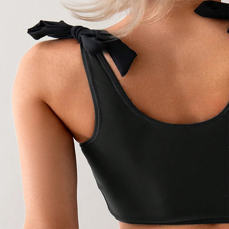 Women's coconut print bikini swimsuit with lace-up detail on the top.