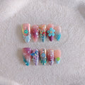 Handmade sculpture manicure set with colourful embossed flower and butterfly patterns on almond shaped nails