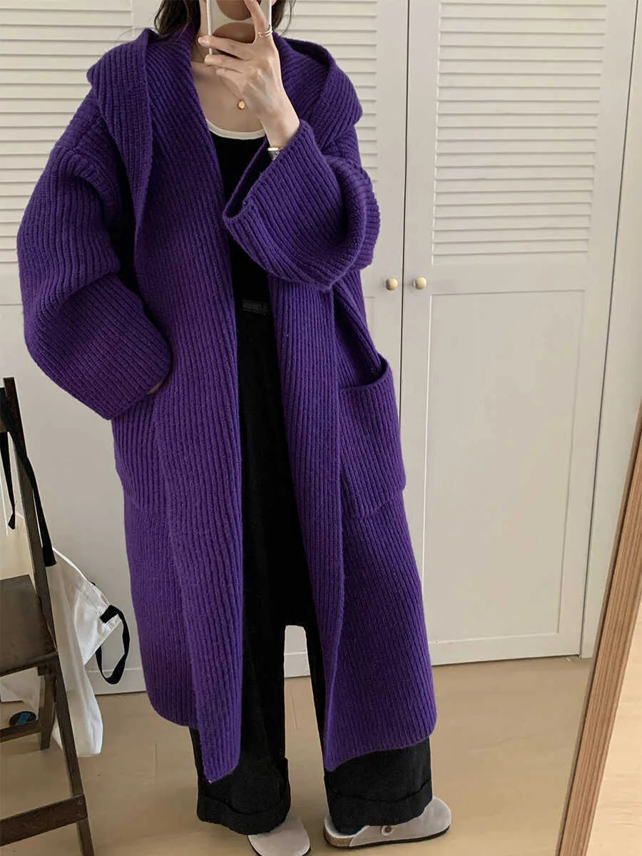 Loose hooded cardigan coat with raglan sleeves in acrylic fabric showing extended length