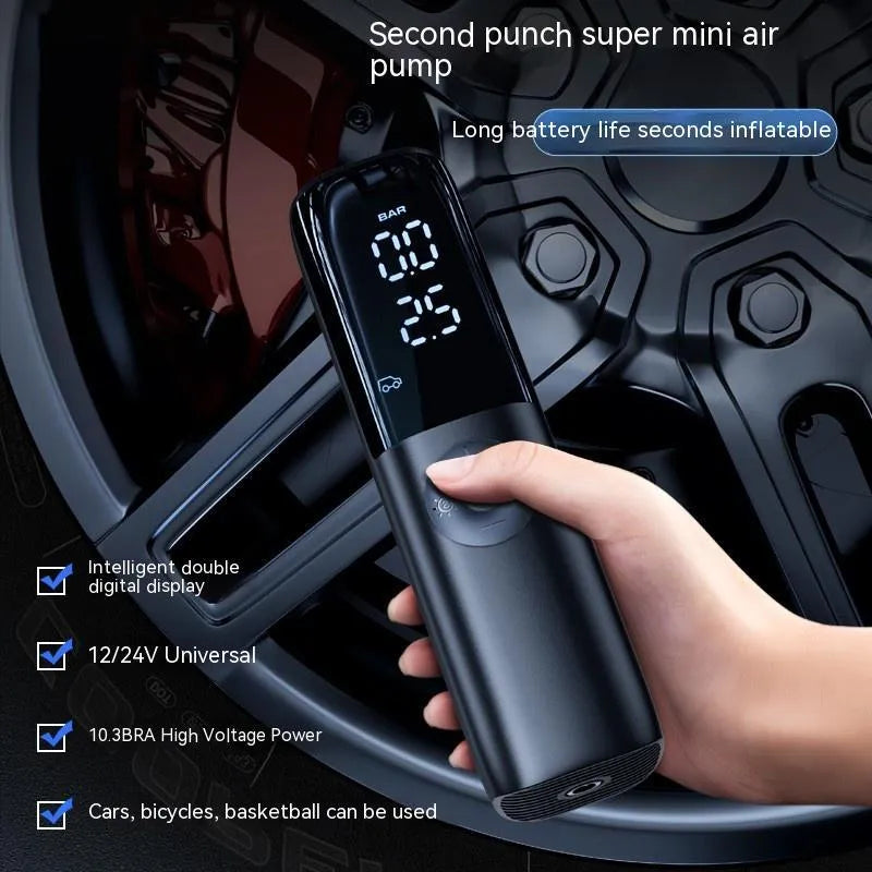 Black portable electric car air pump with plug-in connector and tyre pressure gauge