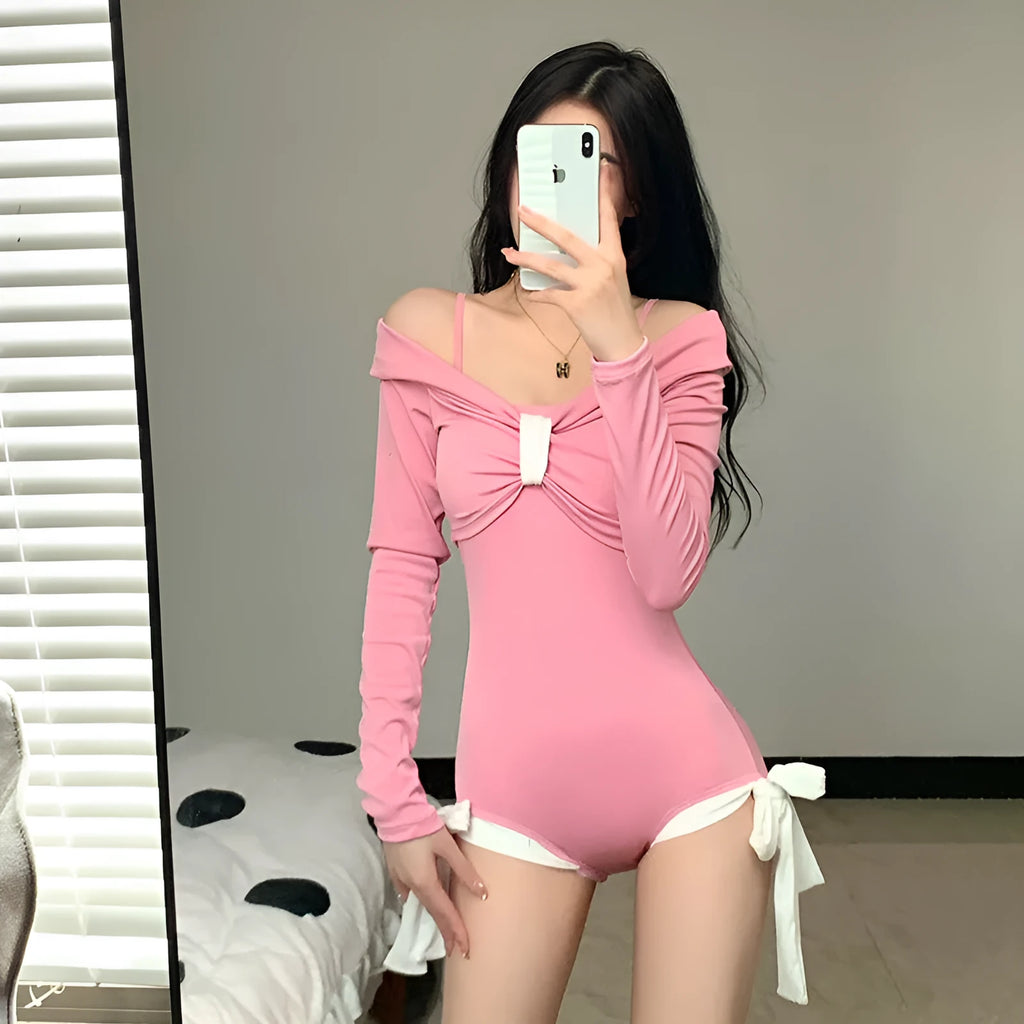 Women's long sleeve one-piece swimsuit in polyester fabric available in black or pink colours