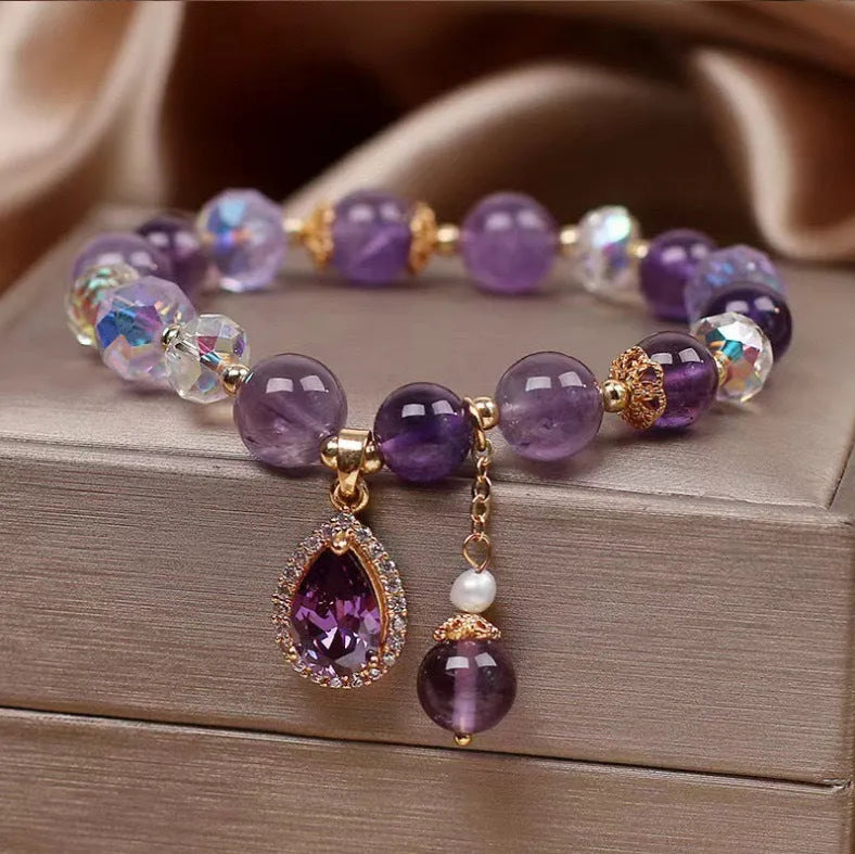Close-up of a women's bracelet with natural purple amethyst stones set using micro inlay craftsmanship.