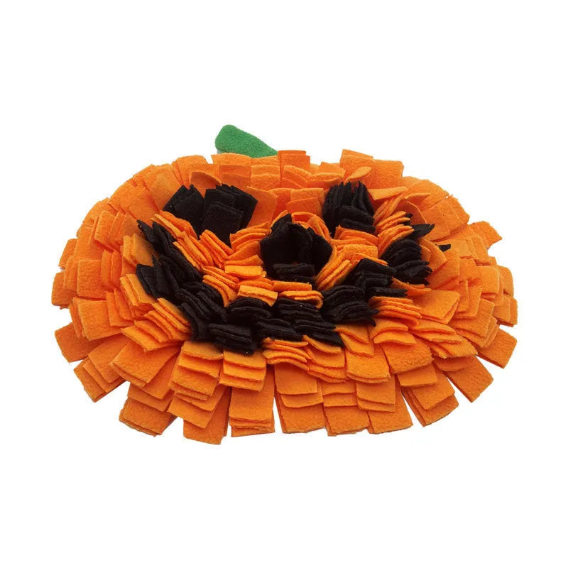 Orange pumpkin-shaped pet smell mat with textured pockets for dog training and slow feeding.