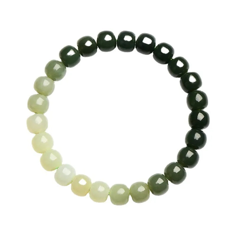 Natural Hetian jade bracelet showing a clear water gradient colour on polished beads.