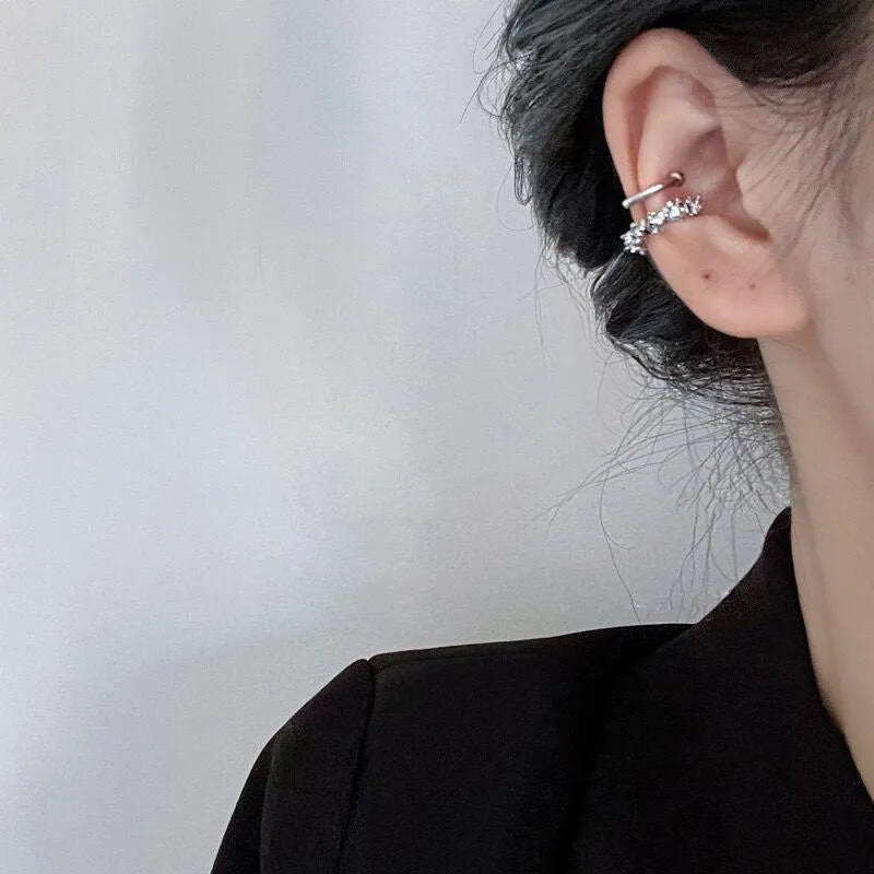A pair of silver-toned geometric clip-on earrings with an irregular frosty finish and double drop design.
