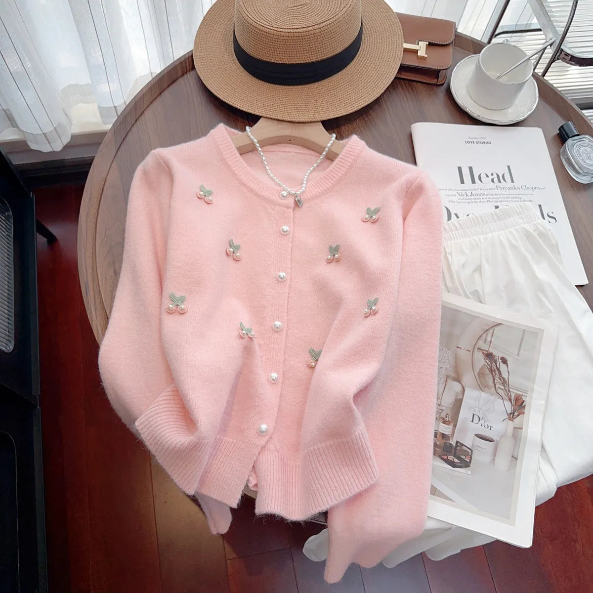 Slim fit cashmere cardigan with beaded detailing in pink, shown open as a layer.