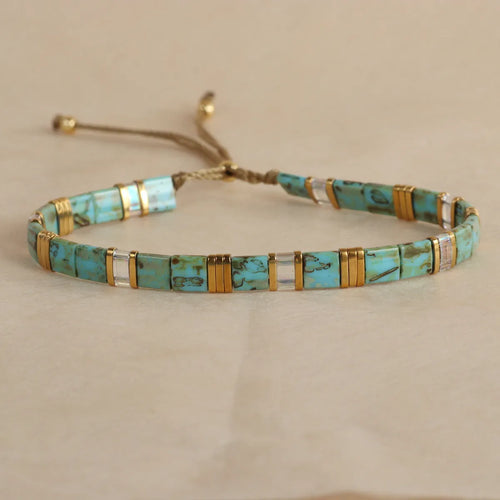 Geometric glass pull bead bracelet in milky white, black, green, blue or red with round decorative elements