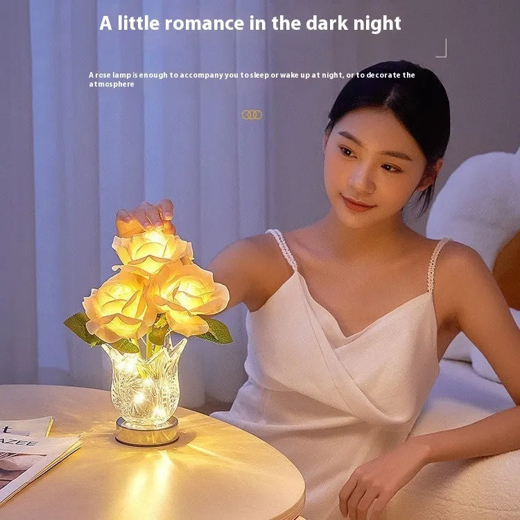Modern crystal flowers design rechargeable touch table lamp with USB cable on a wooden surface.