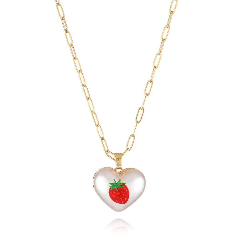 Adjustable heart necklace showing geometric fruit pendants: apple, pineapple, strawberry, cherry, and pear.