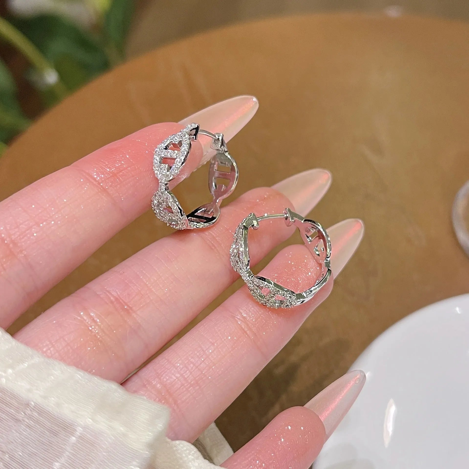 A pair of casual ladies' diamond-effect earrings with thick gold electroplating.