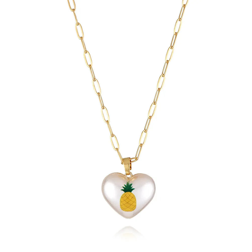 Adjustable heart necklace showing geometric fruit pendants: apple, pineapple, strawberry, cherry, and pear.