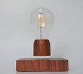 Magnetic levitation floating bulb on imitation wood base with glass enclosure and ABS construction