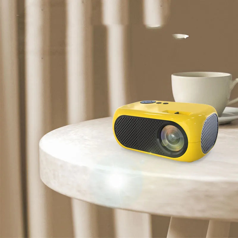 M24 micro mini portable LED projector in gold or white with compact design