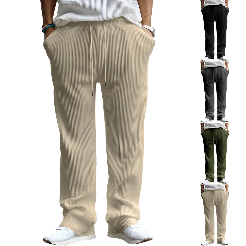 Man wearing loose fit high-waist straight leg casual trousers in Army Green.