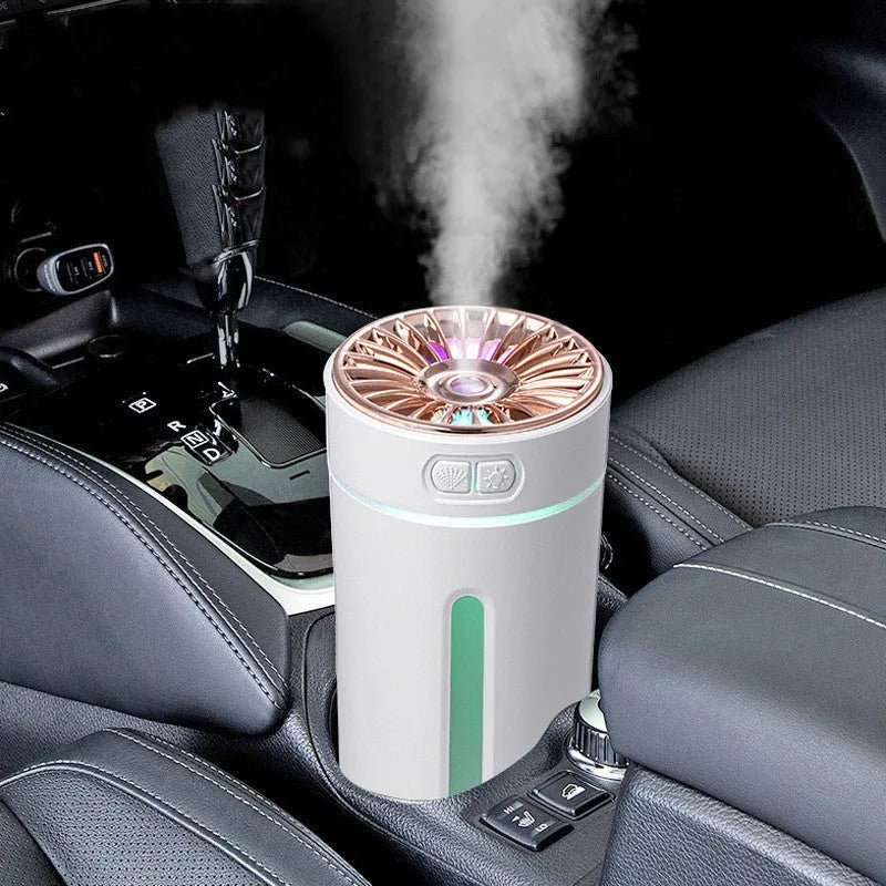Black portable USB humidifier with colourful LED lights, shown next to a USB cable, suitable for car cup holders.