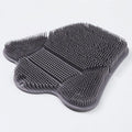 Blue silicone bath massage cushion mat for body scrubbing, shown on a bathroom surface.