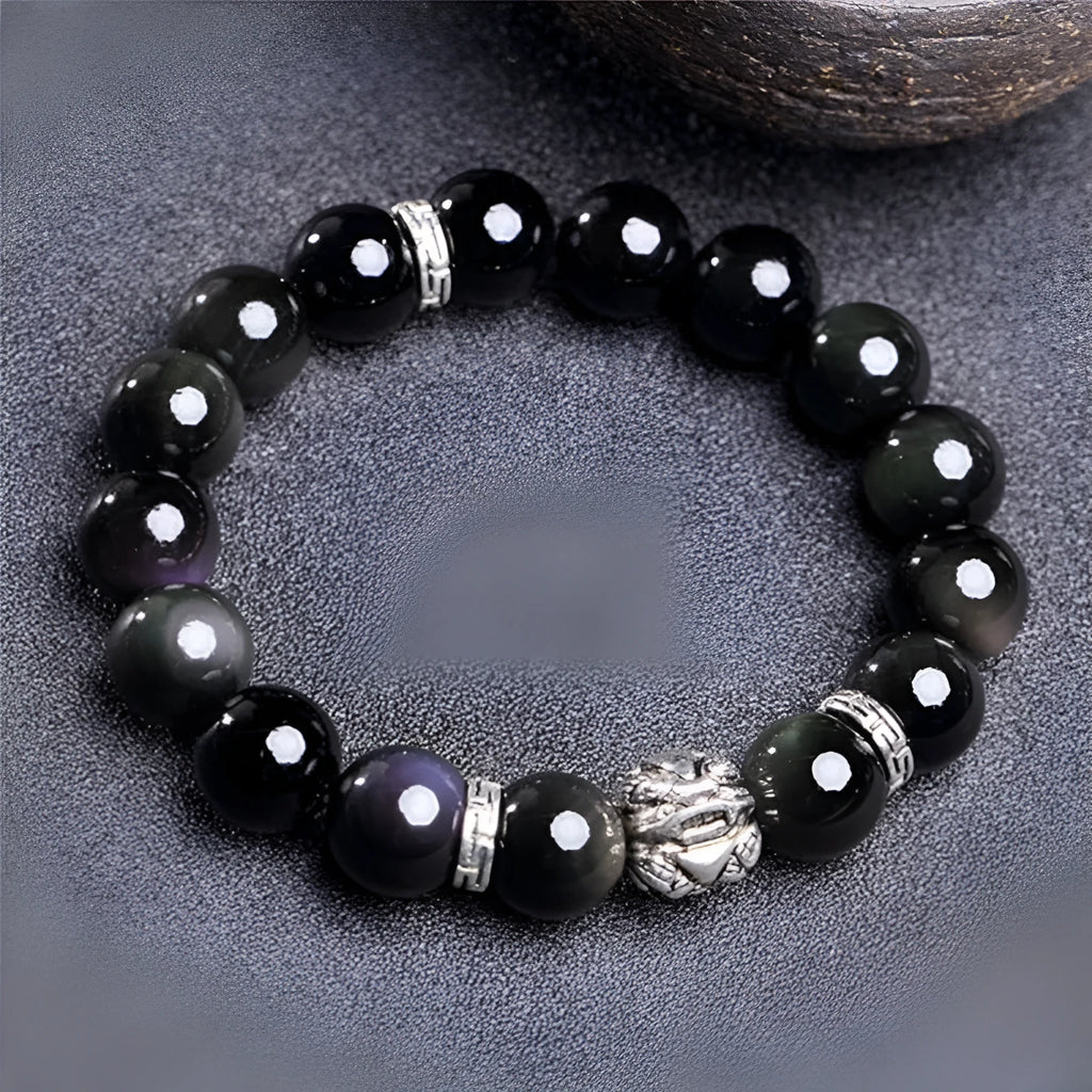 A silver and black obsidian bead bracelet showing lucky colour eye pattern, displayed in two sizes.