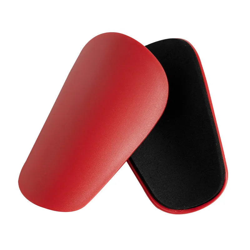 PU mini shin guards in various colours on a leg, showing S and XS sizing for sports protection.