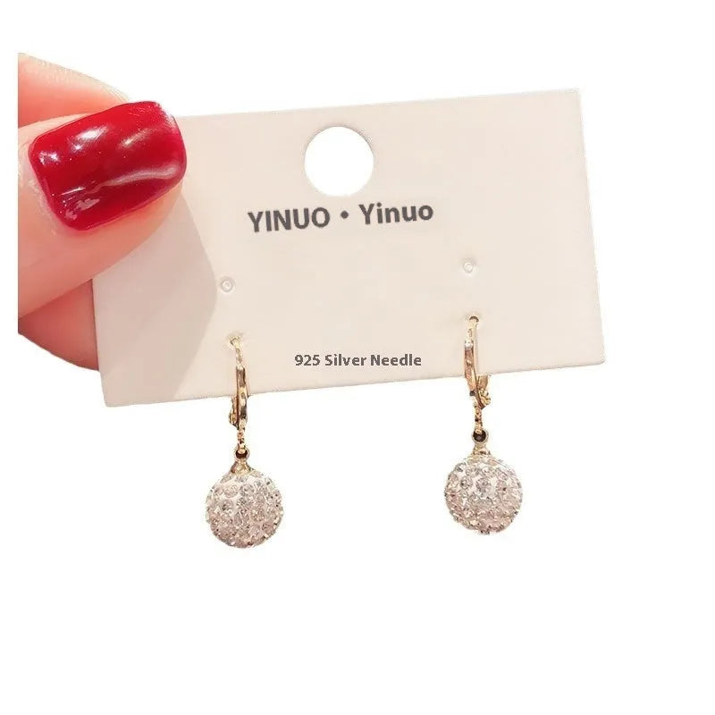 Geometric rose design copper earrings with zircon stones in an electroplated colour finish.