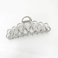 Large minimalist hair clip in gold or silver with tassel detail for updo styling