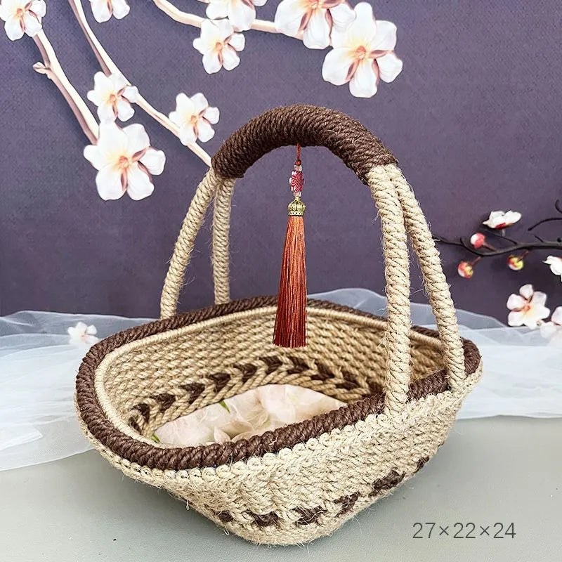 A hand-woven straw basket in a coffee brown colour, measuring 19cm by 12cm.