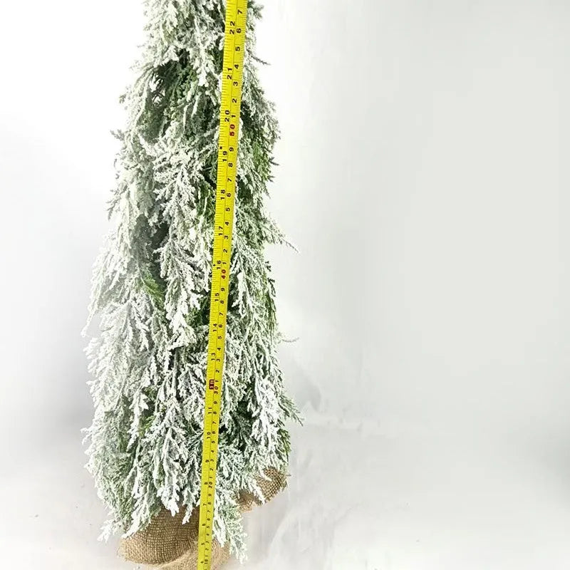 24-inch white snowy plastic desktop Christmas tree with built-in lights and one ornament.