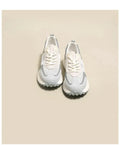 Women's grey and pink retro low-top sneaker with round toe and rubber sole.