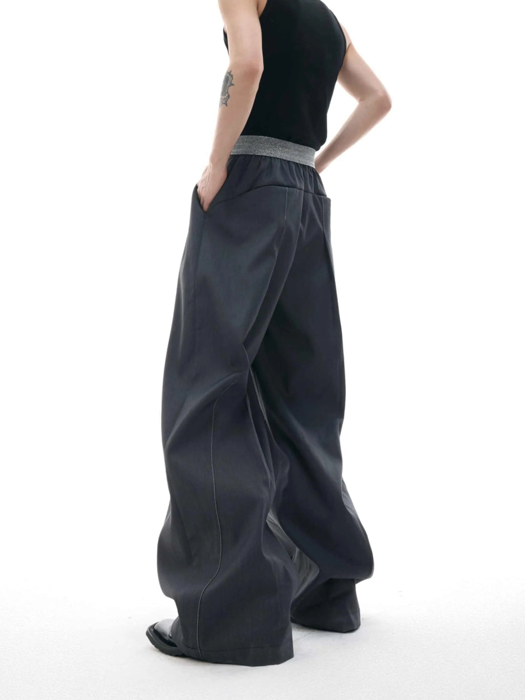 Straight-leg high-waist casual trousers in grey with a button-open line design detail on the leg.