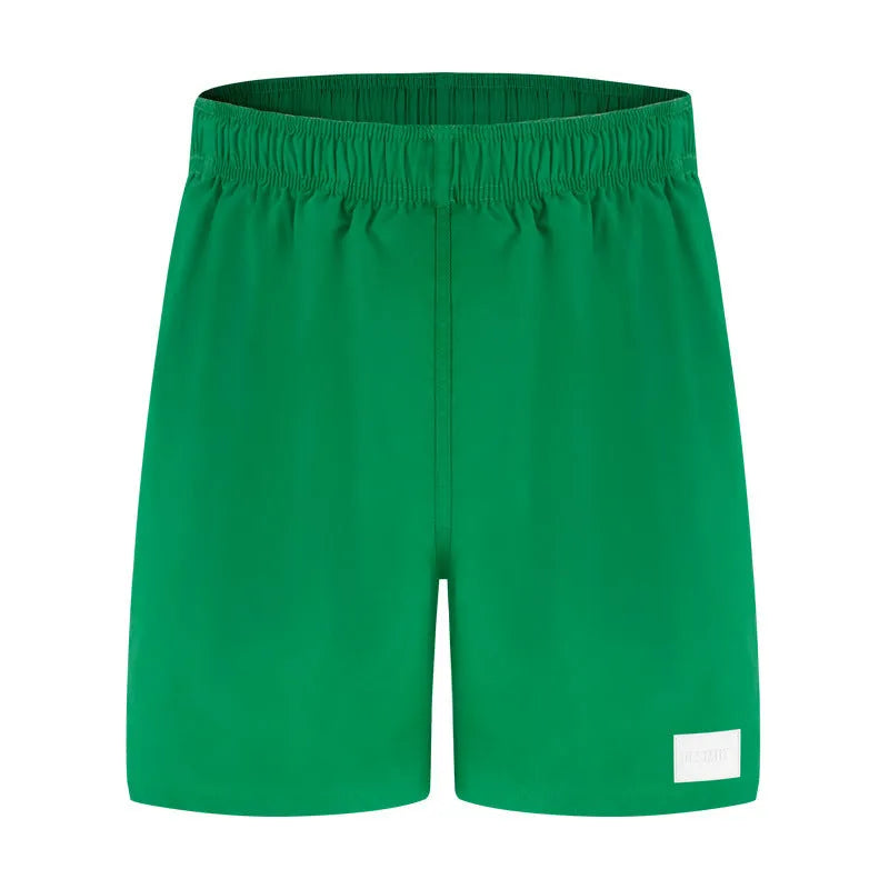 Men's quick-drying nylon beach shorts in solid colours with straight leg opening