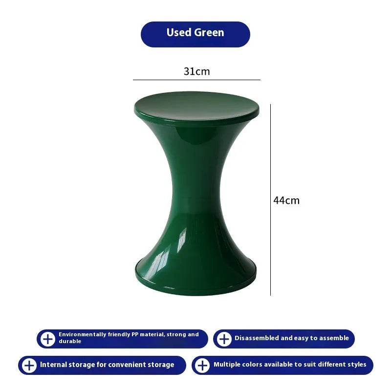 Hourglass-shaped plastic shoe changing stool in green, shown as a step aid.