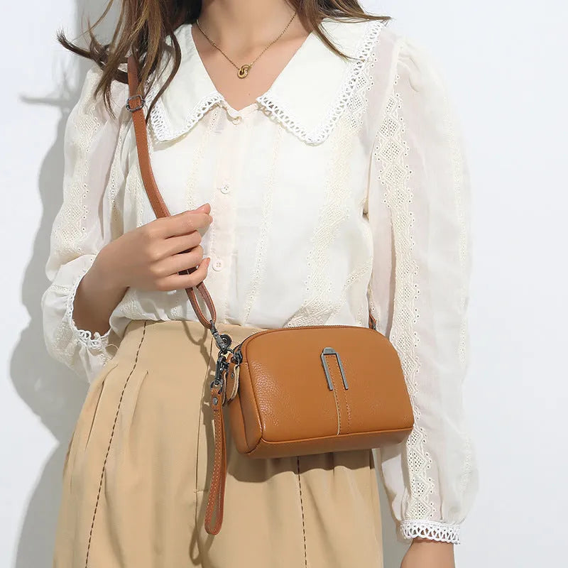 Black genuine leather women's square shoulder bag with a structured horizontal shape