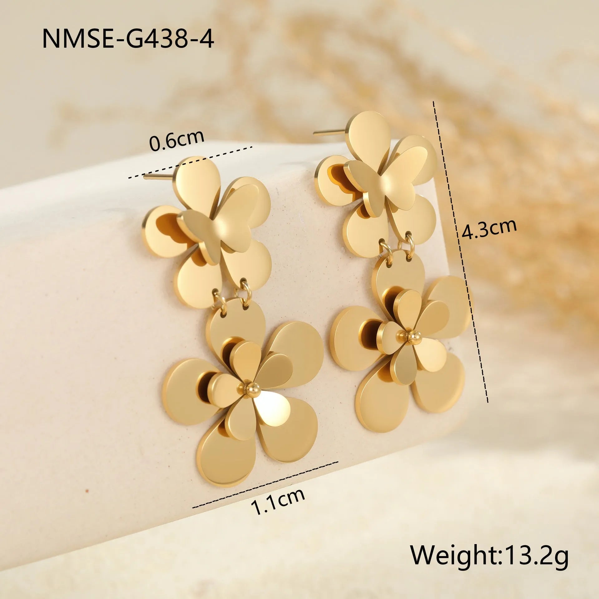 Women's stainless steel earrings with gold electroplated finish and floral butterfly design