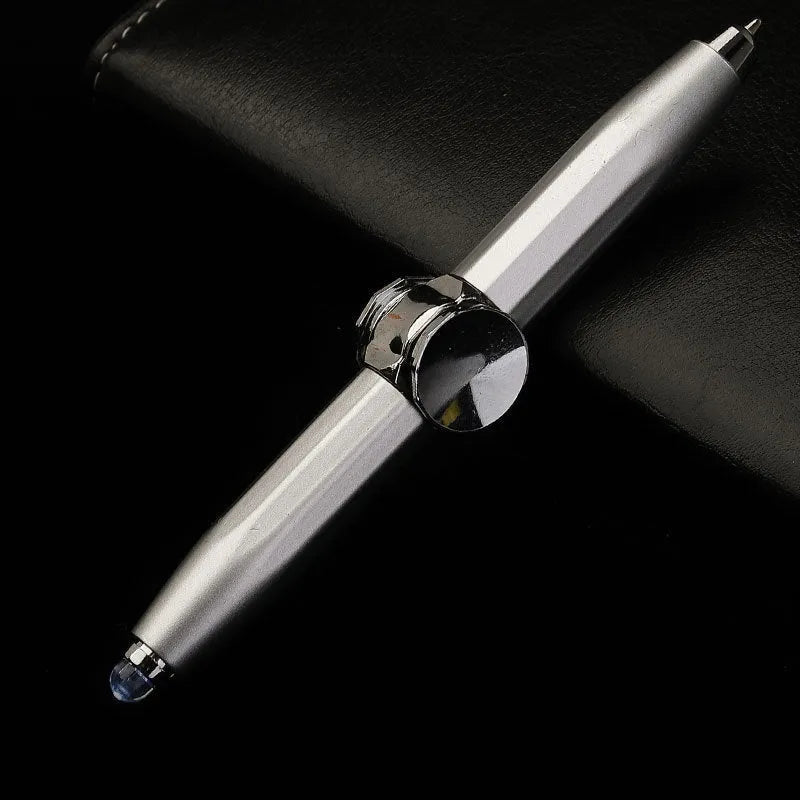 Metal ballpoint pen with integrated LED gyro spinner showing colour-changing lights during spinning