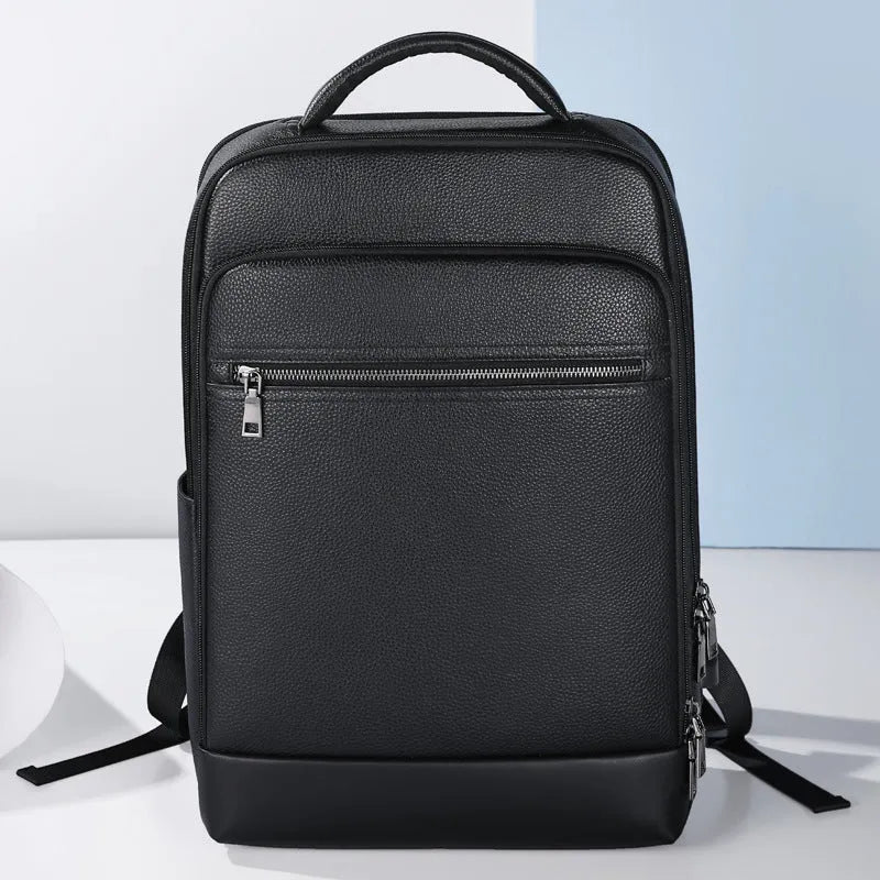 Black genuine leather men's business backpack with curved shoulder straps and visible sewing lines