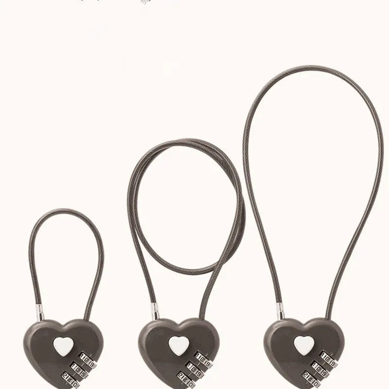 Peach heart design wire rope lock in ABS plastic, shown with steel cable, for securing bicycle helmets.