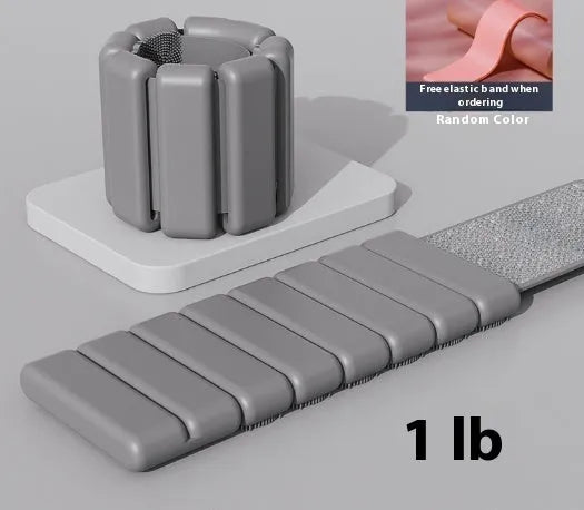 Velcro silicone fitness bracelet with detachable weight in black, blue, gray, or pink.