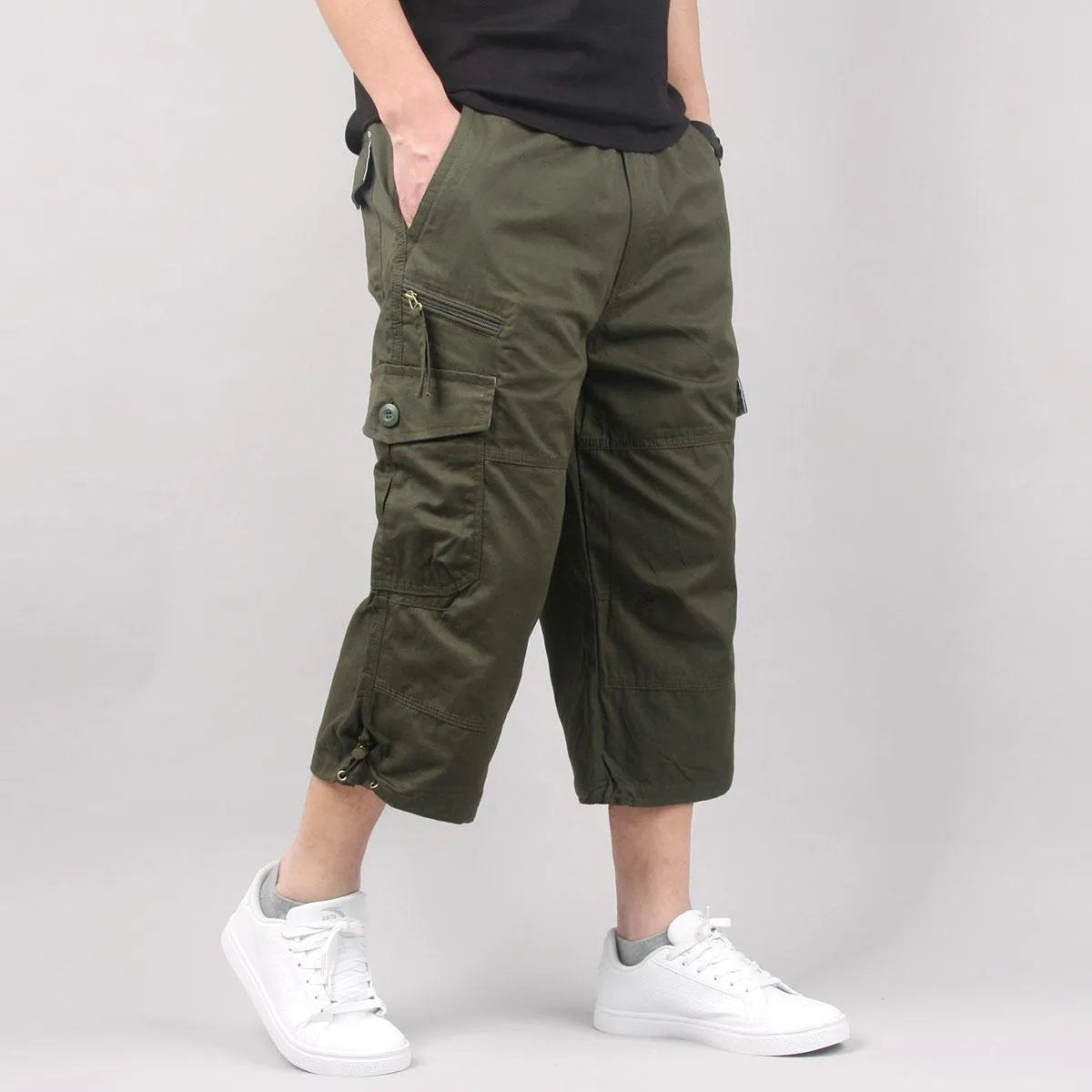 Men's loose fit cotton cropped casual pants in khaki colour on a neutral background.